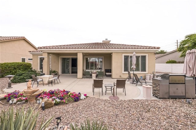 rear view of house featuring a patio