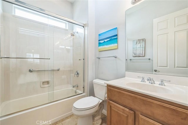 full bathroom featuring tile patterned flooring, vanity, toilet, and enclosed tub / shower combo