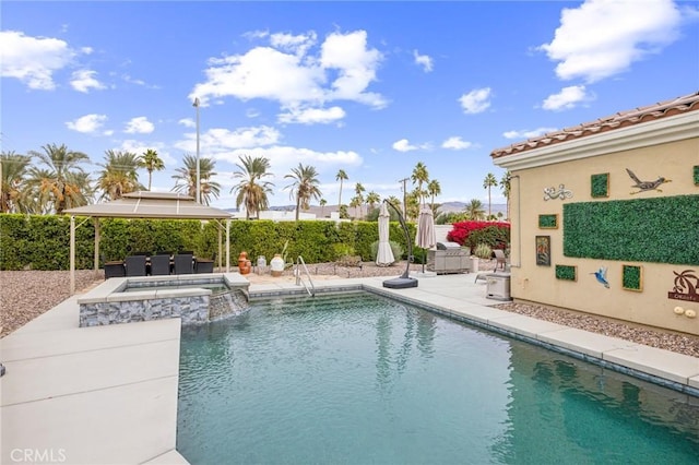 view of pool with a gazebo, an in ground hot tub, and a patio