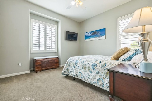 bedroom featuring ceiling fan and light colored carpet