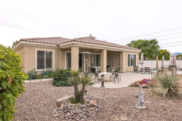 rear view of property with a patio area