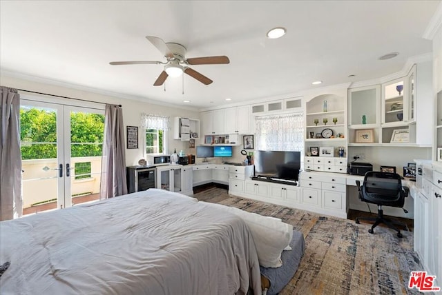 bedroom with ceiling fan, access to outside, built in desk, ornamental molding, and french doors