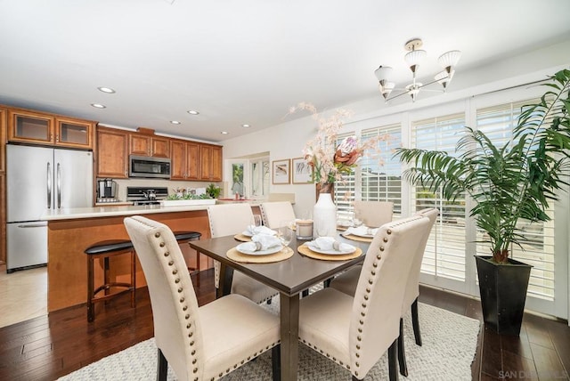 dining space with dark hardwood / wood-style floors