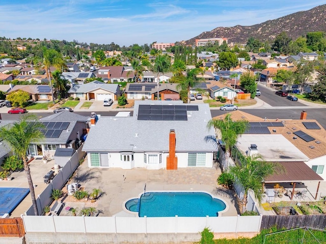 birds eye view of property with a mountain view