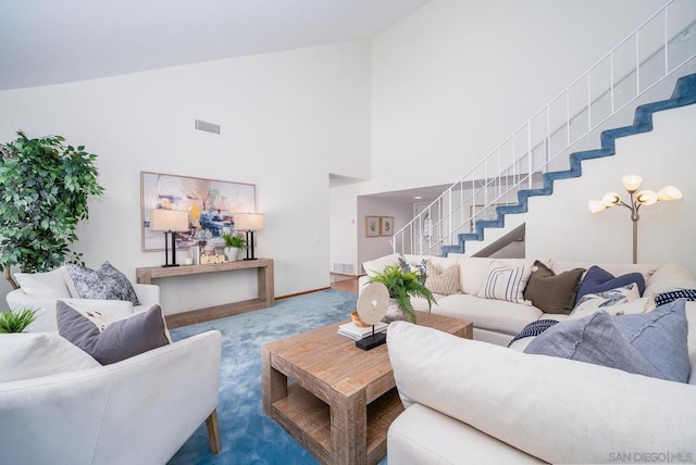 living room featuring high vaulted ceiling