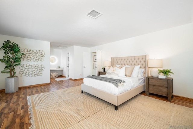 bedroom with hardwood / wood-style flooring