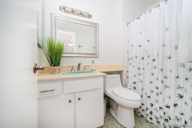 bathroom featuring vanity, toilet, curtained shower, and tile patterned flooring