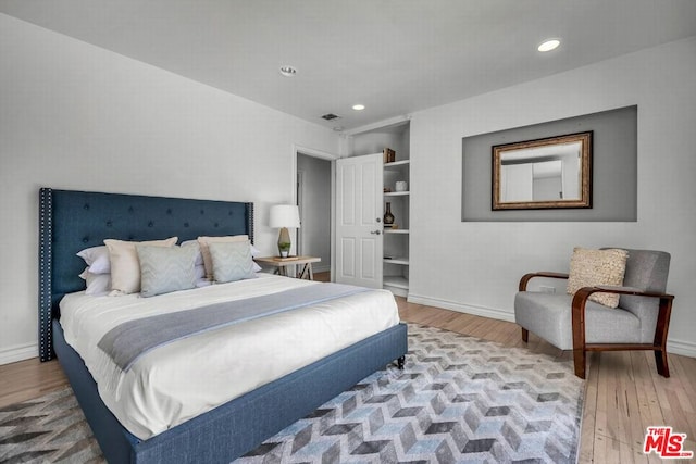 bedroom with light wood-type flooring