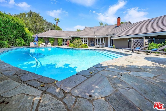 view of pool with a patio