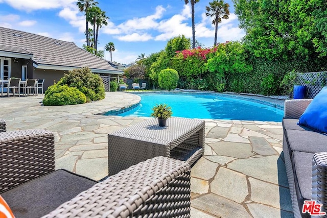 view of pool with a patio area