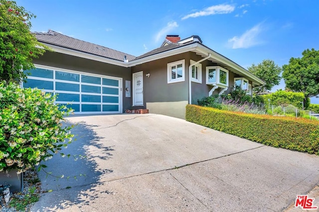 single story home featuring a garage