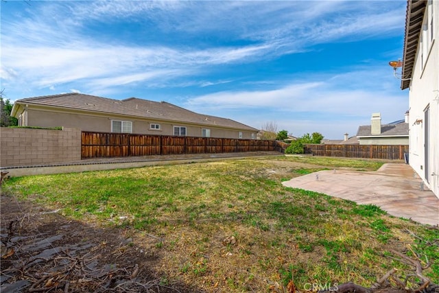 view of yard featuring a patio area and a fenced backyard