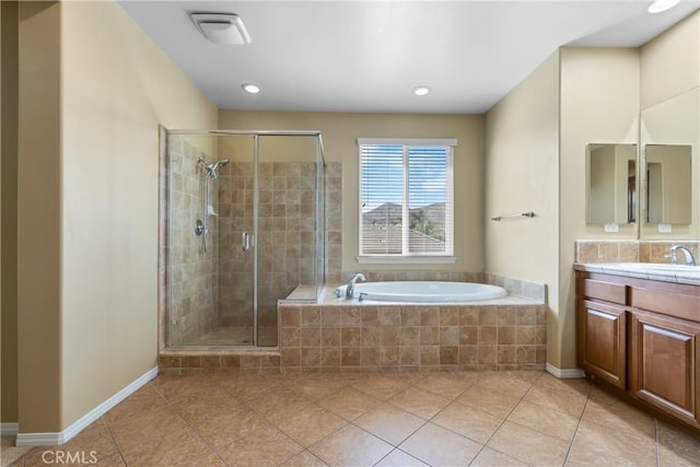 full bathroom with a bath, tile patterned floors, vanity, and a stall shower