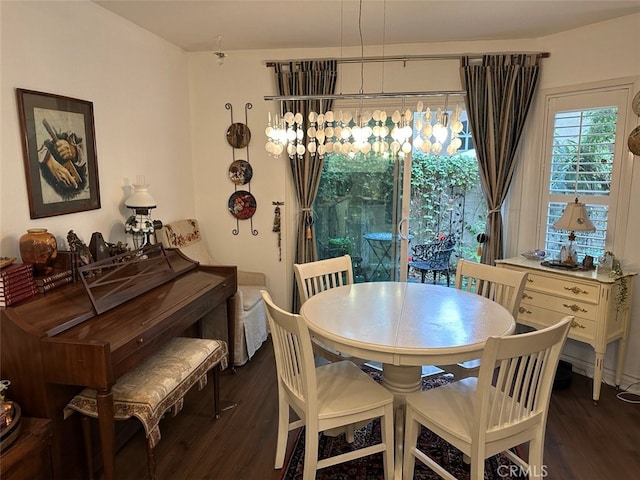 dining area featuring dark wood-type flooring