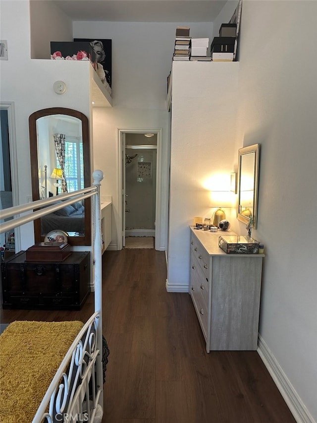 hallway with dark wood-type flooring