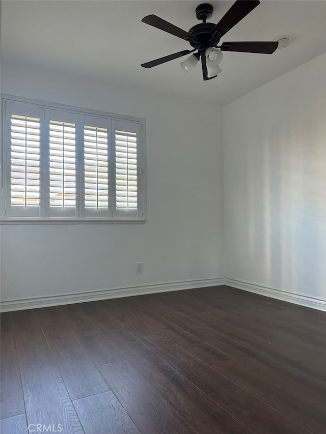 unfurnished room featuring ceiling fan, dark hardwood / wood-style flooring, and a wealth of natural light