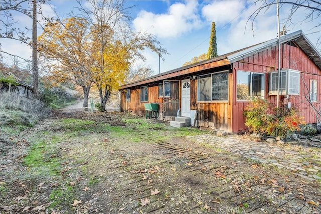 rear view of house with entry steps