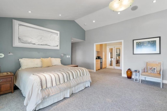 carpeted bedroom featuring lofted ceiling