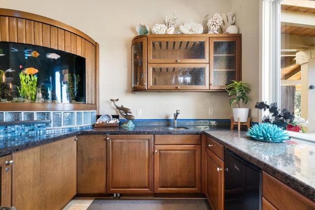 bar featuring beam ceiling, sink, light tile patterned floors, and dark stone countertops