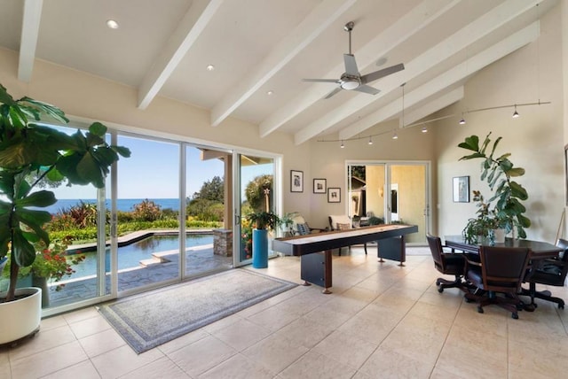 recreation room featuring vaulted ceiling with beams, ceiling fan, and light tile patterned flooring