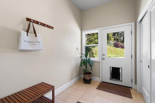 doorway featuring light tile patterned flooring