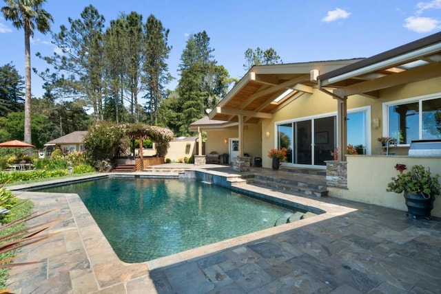 view of swimming pool with a patio