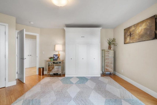 bedroom with light hardwood / wood-style floors