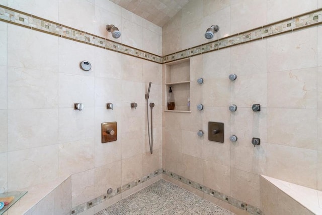 bathroom featuring tiled shower