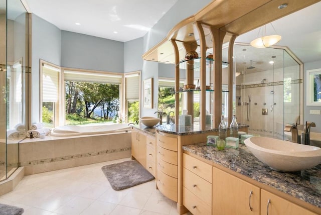 bathroom with plenty of natural light, vanity, and shower with separate bathtub