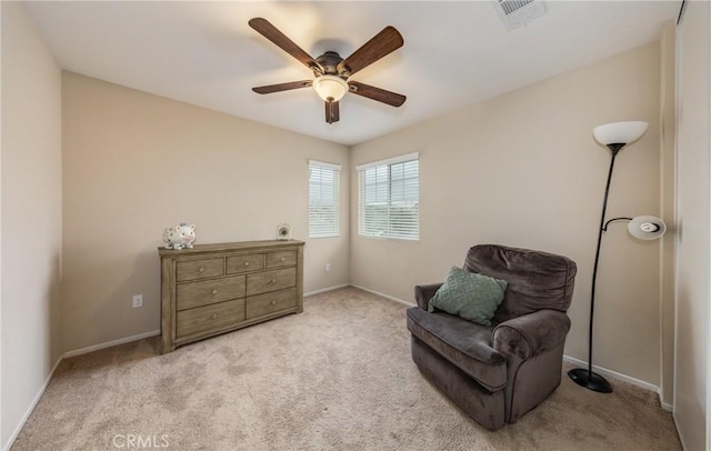 sitting room with light colored carpet and ceiling fan