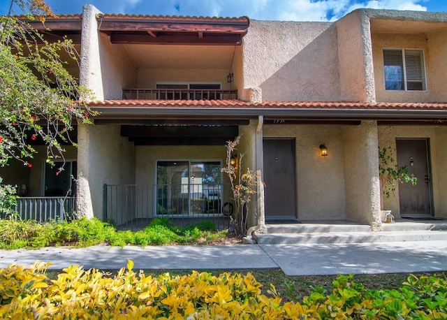 view of front of home with a balcony