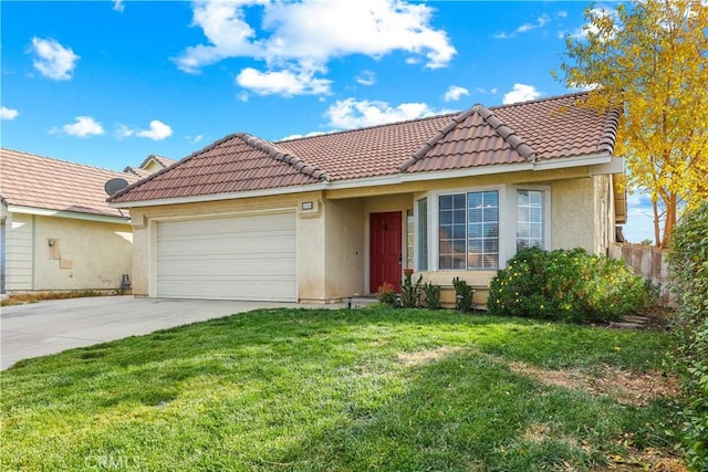 view of front of home with a front yard and a garage