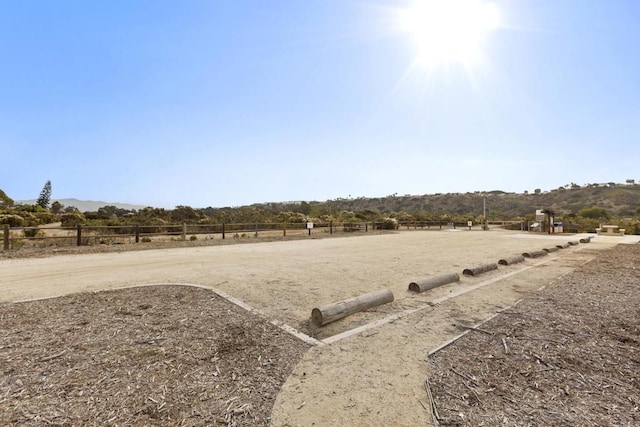 view of yard with a rural view