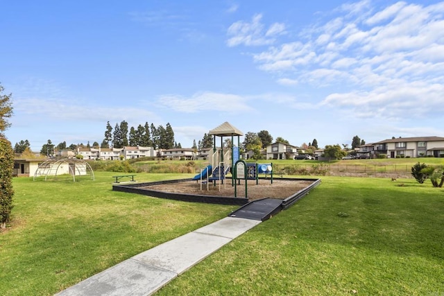 community play area featuring a yard