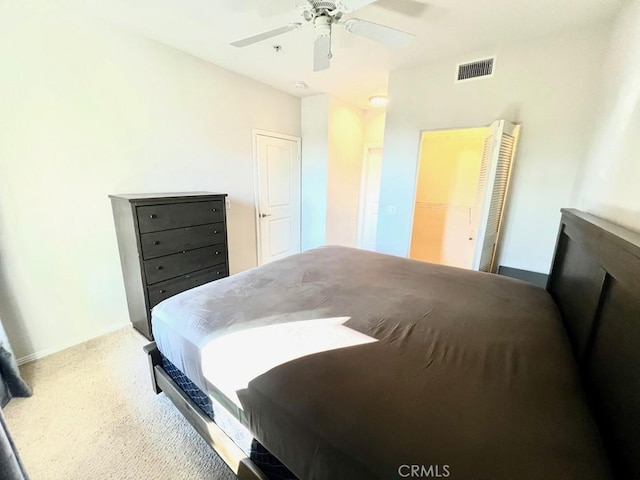 bedroom with carpet flooring, ceiling fan, and a closet