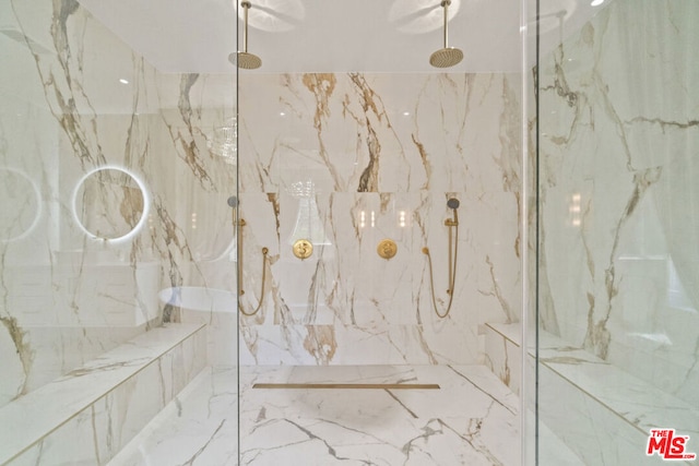 bathroom featuring tiled shower