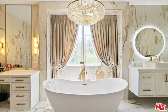 bathroom with vanity, a tub to relax in, and an inviting chandelier