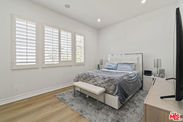 bedroom featuring light wood-type flooring