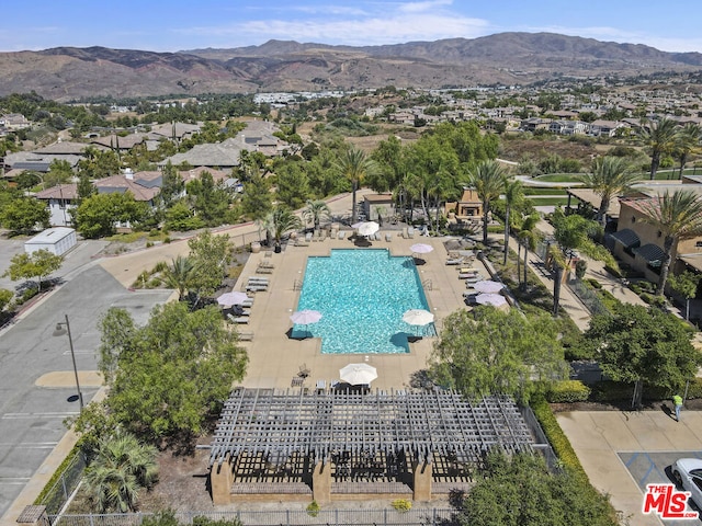 birds eye view of property featuring a mountain view