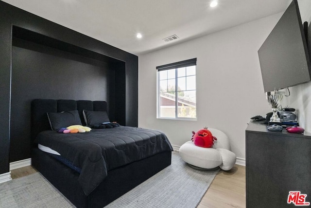 bedroom featuring light wood-type flooring