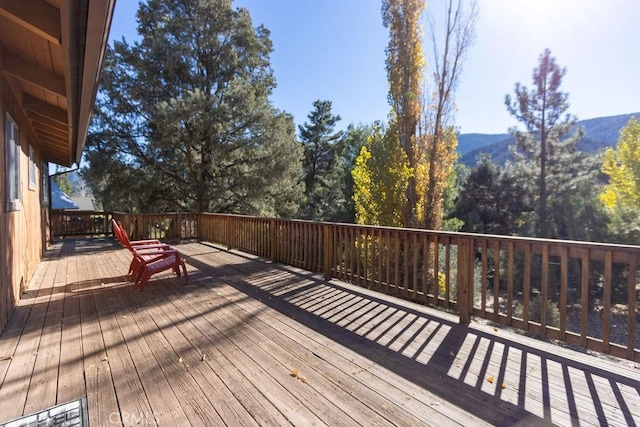 wooden deck with a mountain view