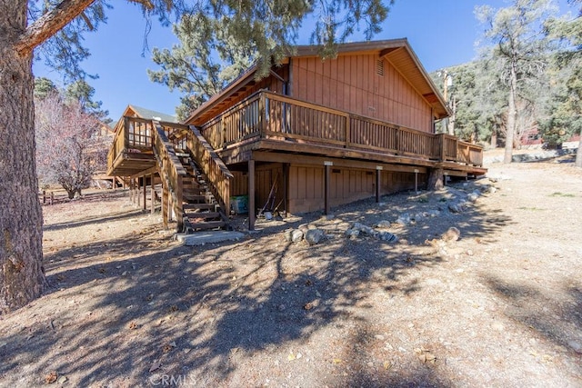 back of house featuring a deck