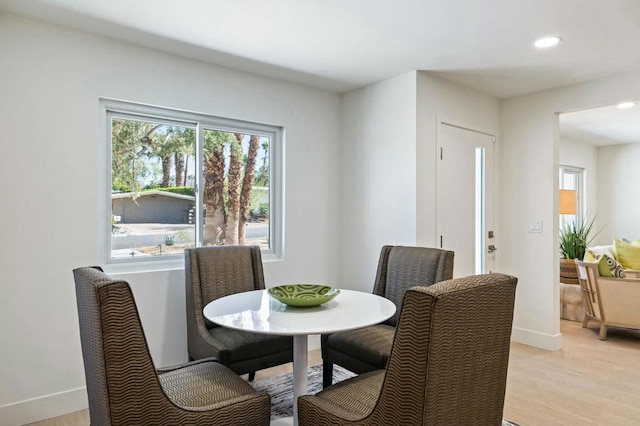 dining area with light hardwood / wood-style flooring