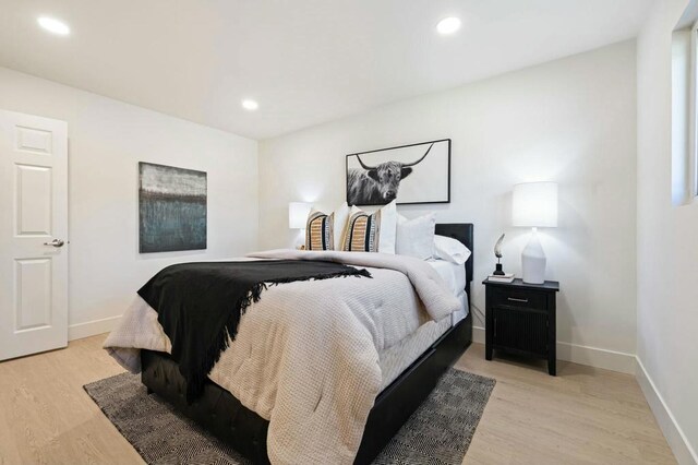 bedroom with light hardwood / wood-style flooring