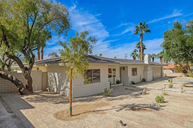 single story home featuring a garage