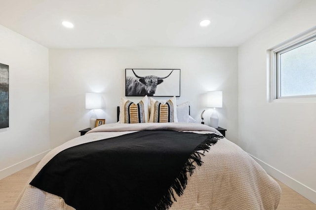 bedroom with light hardwood / wood-style floors