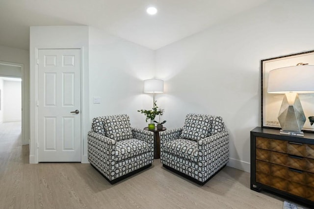 sitting room with hardwood / wood-style flooring