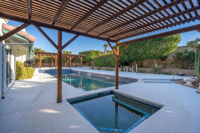 view of pool featuring a pergola, an in ground hot tub, and a patio