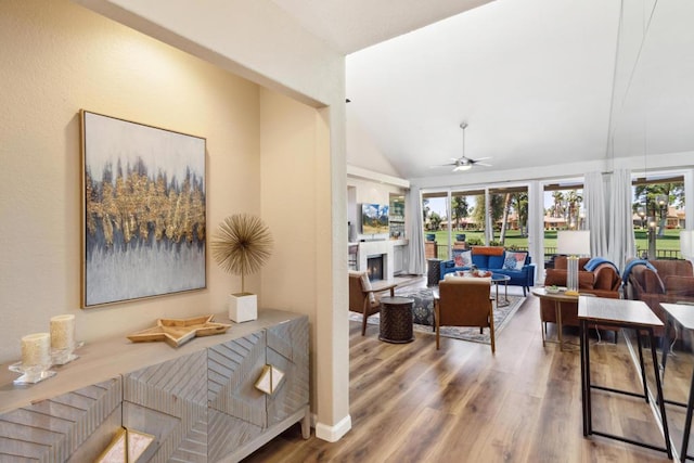 interior space featuring ceiling fan, a healthy amount of sunlight, and lofted ceiling