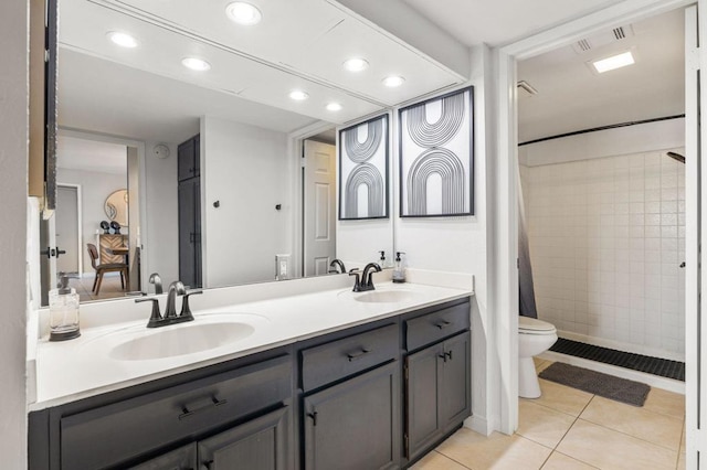 bathroom with curtained shower, tile patterned flooring, vanity, and toilet